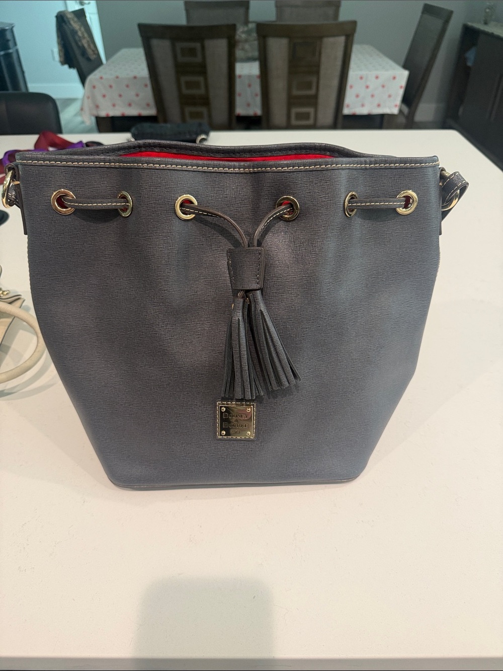 Dooney & Bourke Blue-Gray Tassel Drawstring Crossbody Bag